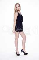 Young slim sexy woman in black dress isolated on white backgroun