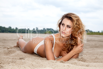 beautiful brunette woman on the beach