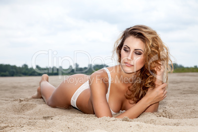 beautiful brunette woman on the beach