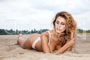 beautiful brunette woman on the beach