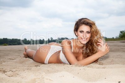 beautiful brunette woman on the beach