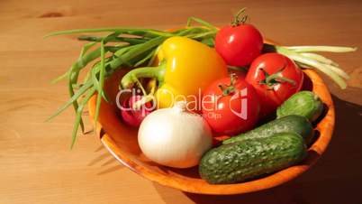 Multiple vegetables on a wooden plate