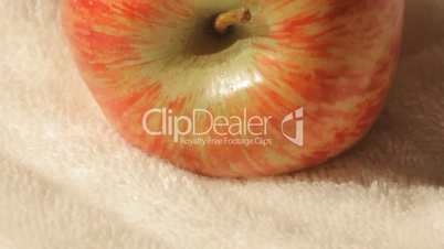 Sliding view of an apple on a white towel