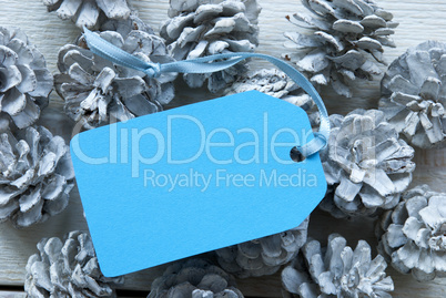 Light Blue Label On Fir Cones With Copy Space
