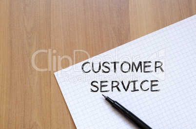 Customer service write on notebook