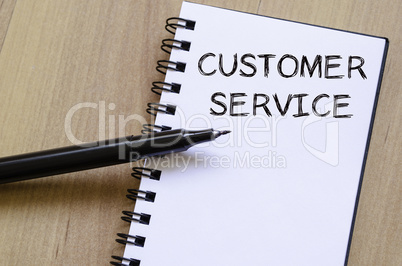 Customer service write on notebook