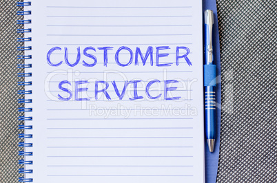 Customer service write on notebook