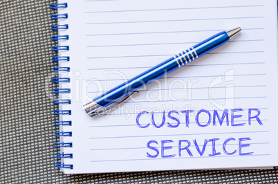 Customer service write on notebook