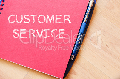 Customer service write on notebook