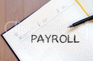Payroll write on notebook