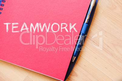 Teamwork write on notebook