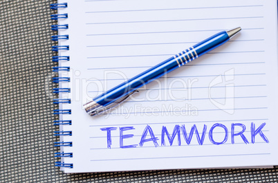 Teamwork write on notebook