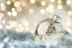 Shiny Christmas bauble and glittering lights