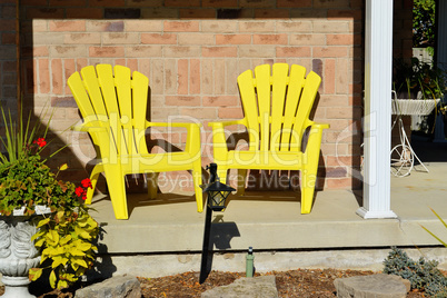 Two yellow wooden chairs.