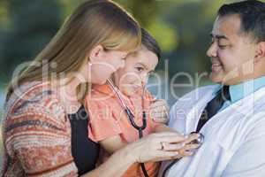 Mixed Race Boy, Mother and Doctor Having Fun With Stethoscope