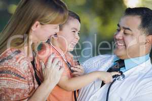Mixed Race Boy, Mother and Doctor Having Fun With Stethoscope