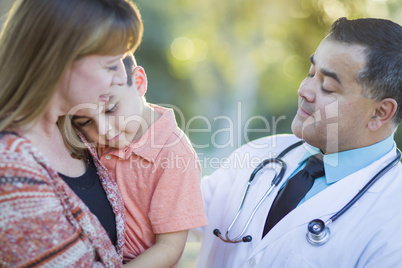 Sick Mixed Race Boy, Mother and Hispanic Doctor Outdoors