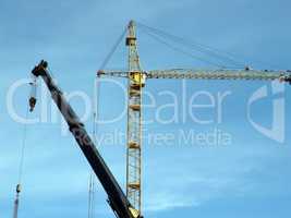 two crane tower on sky background