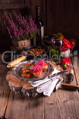 ratatouille with baked potato and beetroot sprouts