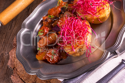 ratatouille with baked potato and beetroot sprouts