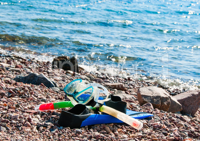 Mask and flippers on the beach