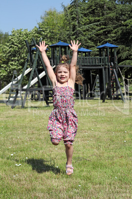 little girl jumping on playground