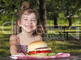 happy little girl picnic in park