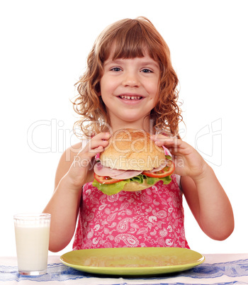 happy little girl with big sandwich