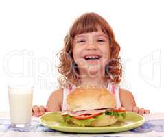 happy little girl with breakfast