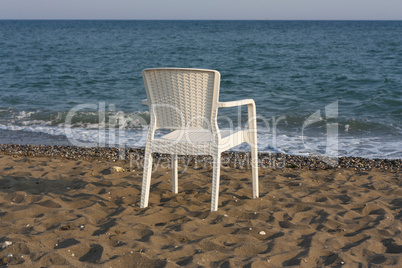 white plastic beach chair photo
