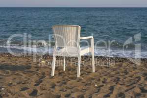 white plastic beach chair photo