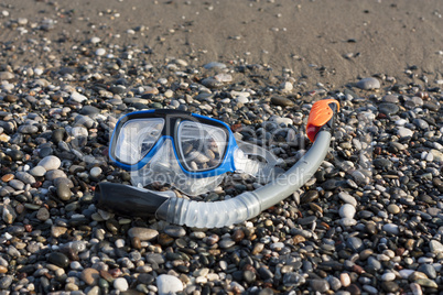 snorkel and scuba mask on the beach photo