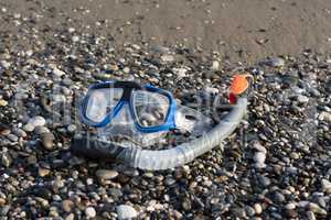 snorkel and scuba mask on the beach photo