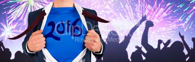Composite image of businessman opening his shirt superhero style