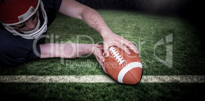 Composite image of american football player scoring a touchdown