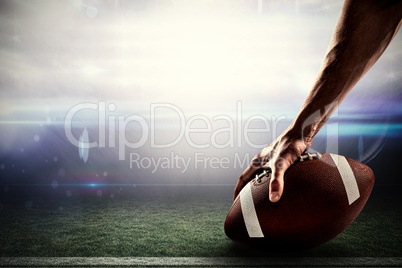 Composite image of cropped image of sports player holding ball