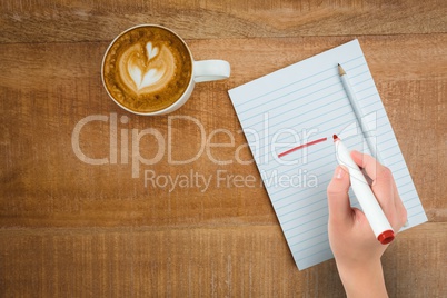 Composite image of businesswomans hand writing with marker