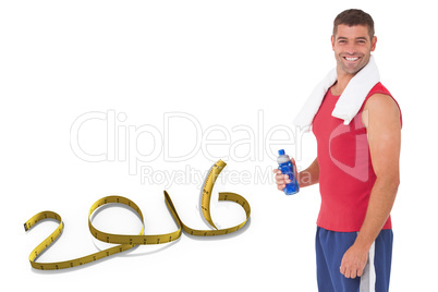 Composite image of fit man smiling at camera