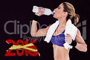 Composite image of strong blonde drinking from water bottle