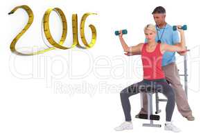 Composite image of trainer helping client lift weights