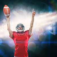 Composite image of american football player with holding ball arms raised
