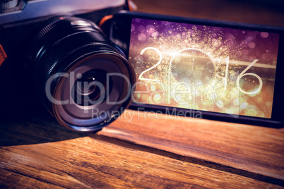 Composite image of smartphone and camera Composite image of smartphone and camera