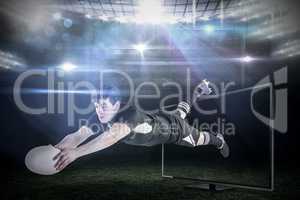 Composite image of a rugby player scoring a try