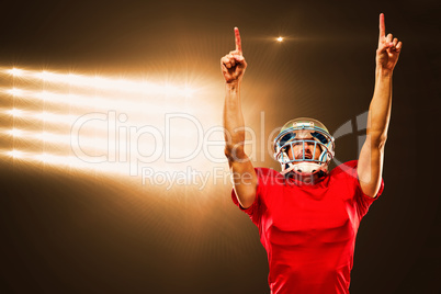 Composite image of american football player looking up with arms