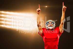 Composite image of american football player looking up with arms