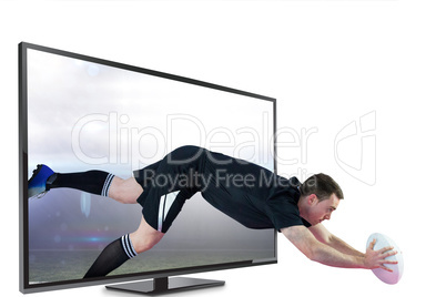 Composite image of a rugby player scoring a try