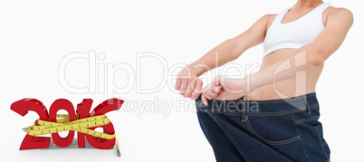 Composite image of brunette in a jeans too big