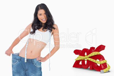 Composite image of smiling sexy woman wearing too big pants