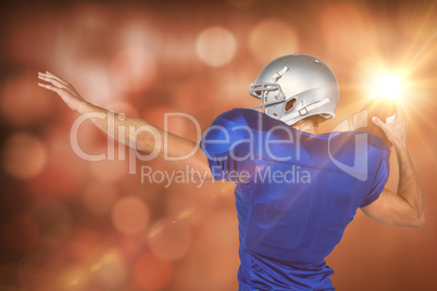 Composite image of rear view of american football player throwin