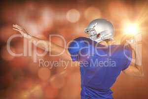 Composite image of rear view of american football player throwin